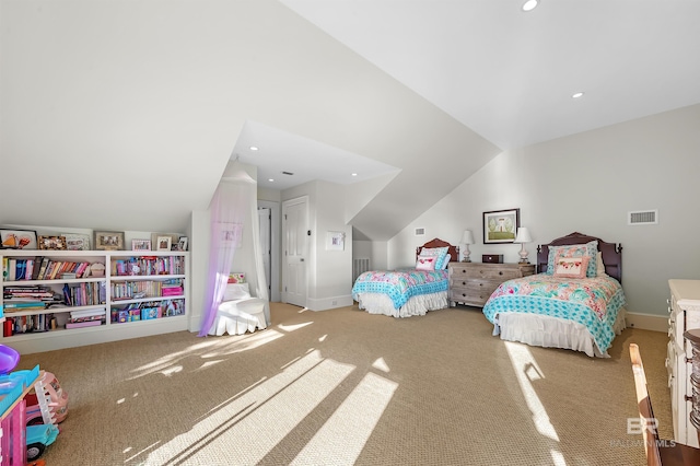 bedroom featuring vaulted ceiling, carpet floors, visible vents, and baseboards