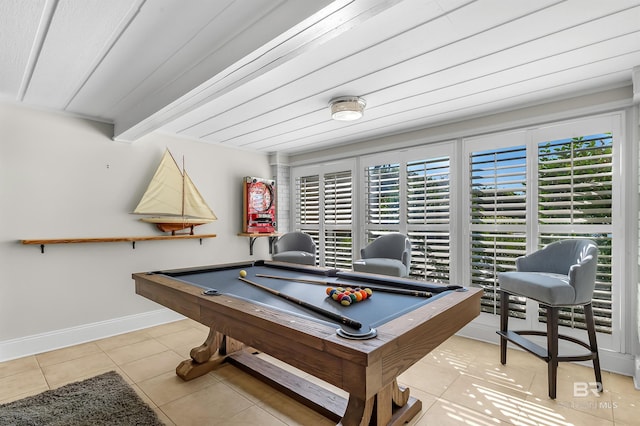 playroom featuring baseboards, billiards, beam ceiling, and tile patterned floors