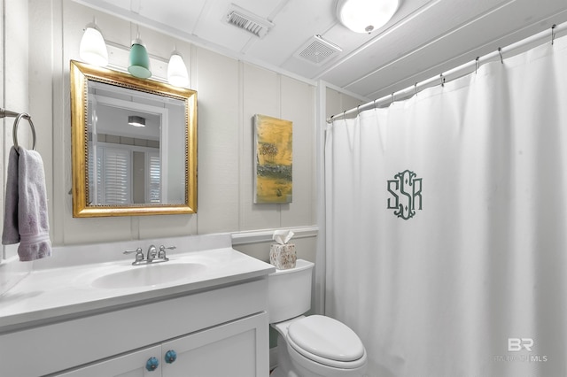 bathroom featuring toilet, visible vents, and vanity