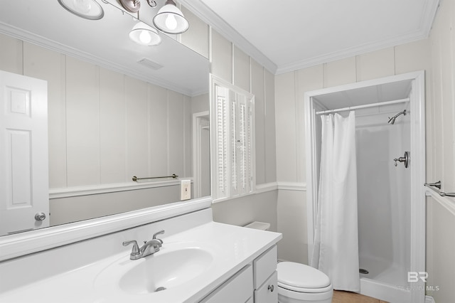 full bath with toilet, a shower stall, crown molding, and vanity