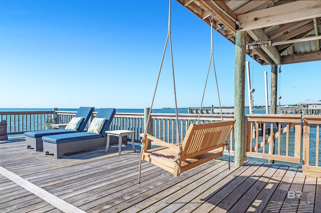 wooden deck with a water view