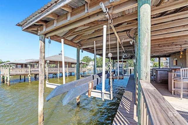 view of dock with a water view and boat lift