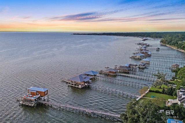 aerial view at dusk with a water view