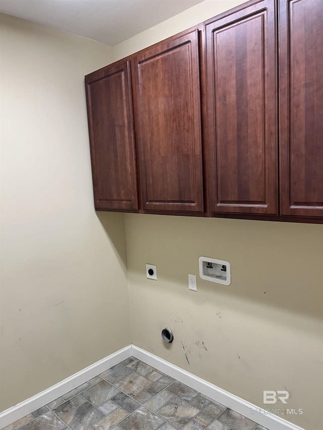 laundry room featuring cabinets, electric dryer hookup, and hookup for a washing machine