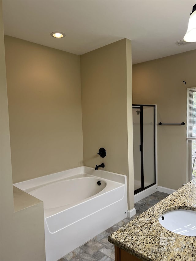 bathroom with vanity and plus walk in shower