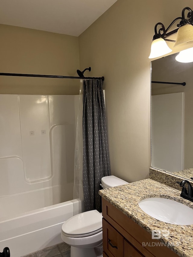 full bathroom with toilet, vanity, tile patterned floors, and shower / bath combo with shower curtain