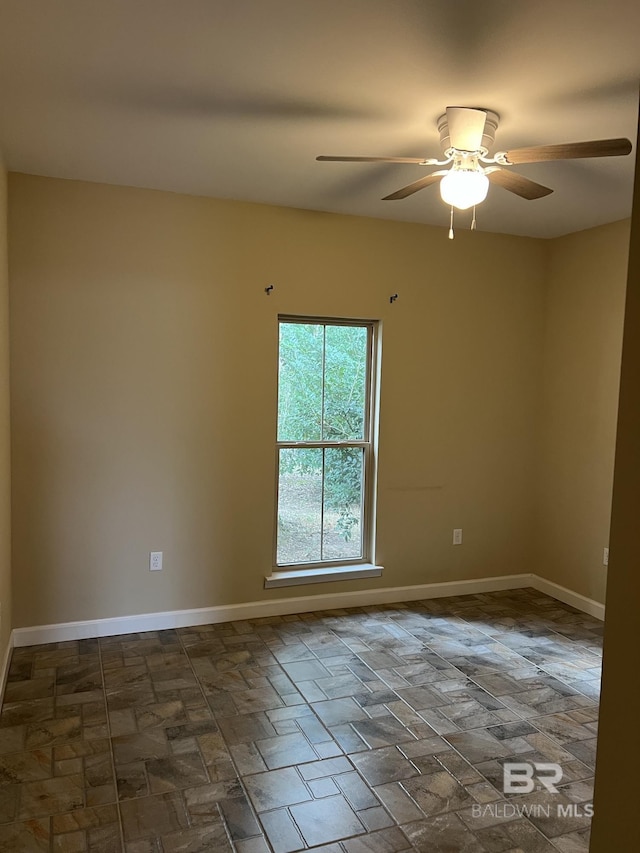 spare room featuring ceiling fan