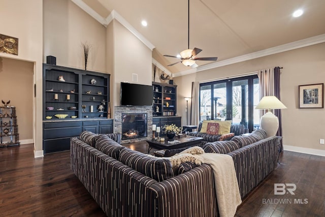 living area featuring baseboards, high vaulted ceiling, a fireplace, ornamental molding, and dark wood-type flooring