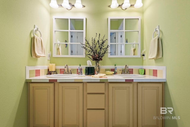 bathroom with double vanity and a sink