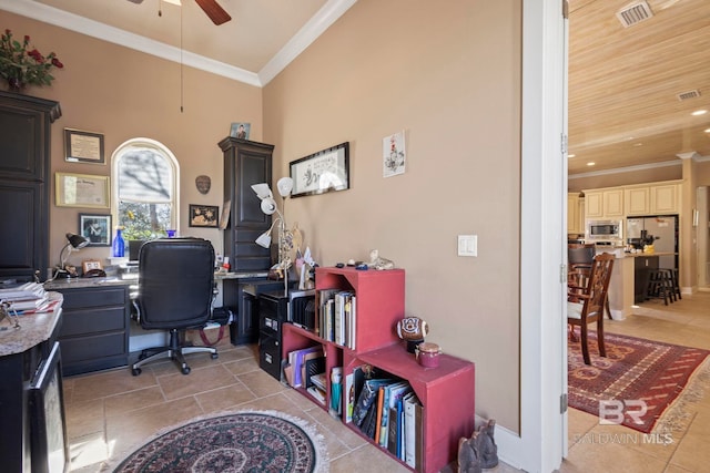 office space featuring crown molding, light tile patterned floors, a ceiling fan, and visible vents