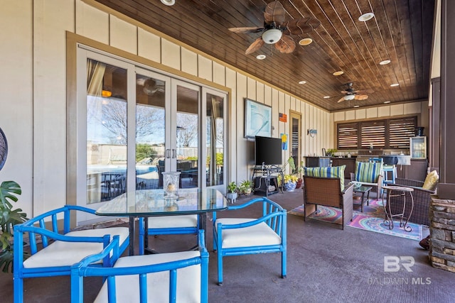 exterior space featuring french doors, ceiling fan, and wooden ceiling