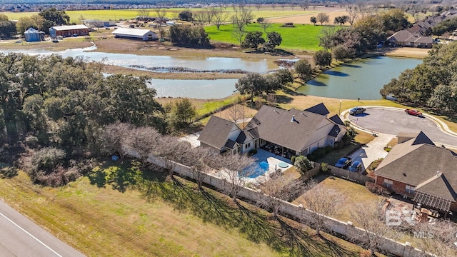 birds eye view of property with a water view