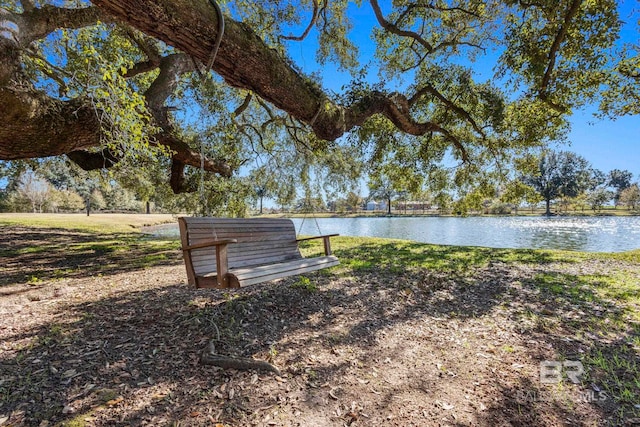 surrounding community featuring a water view