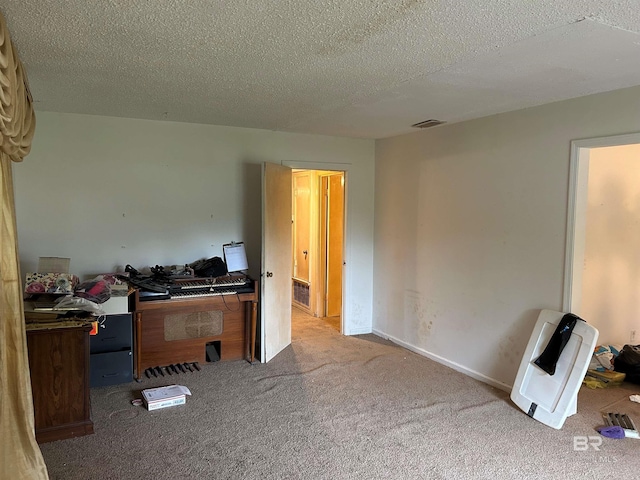 office space with a textured ceiling and carpet floors