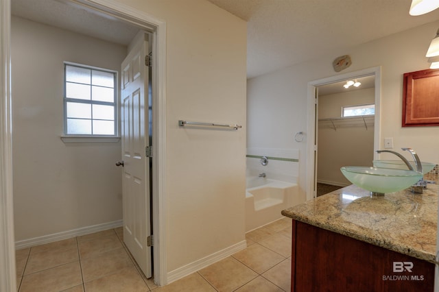 bathroom with tile patterned flooring and vanity