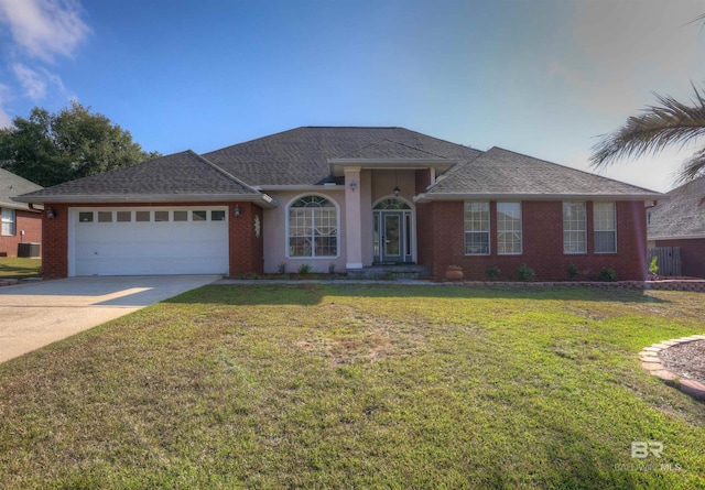 ranch-style house with a garage and a front lawn