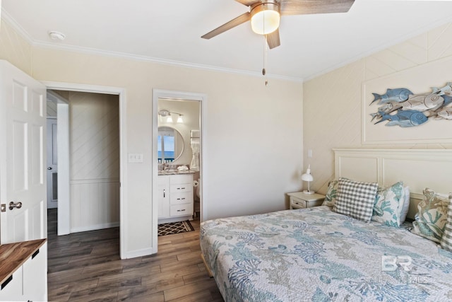 bedroom with ensuite bathroom, wood finished floors, ornamental molding, and a ceiling fan