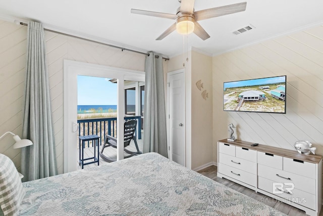 bedroom featuring wood finished floors, visible vents, ceiling fan, access to exterior, and crown molding