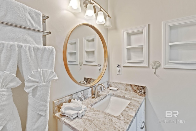 bathroom featuring built in features and vanity