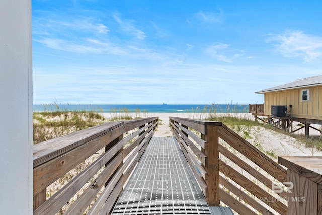 view of property's community with a view of the beach and a water view