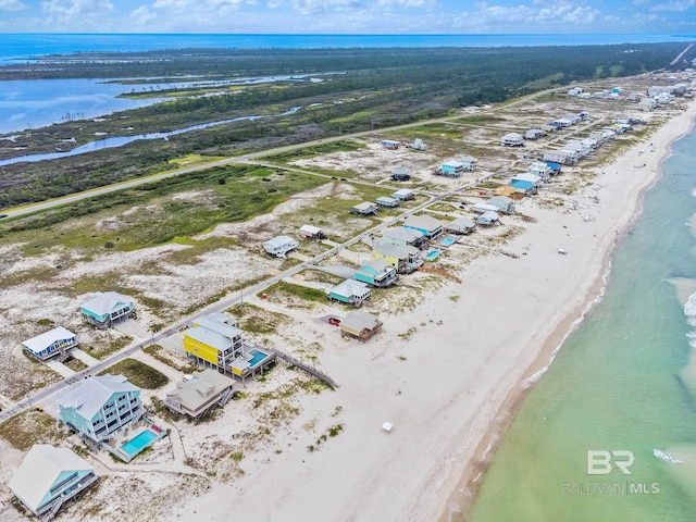 bird's eye view with a beach view and a water view