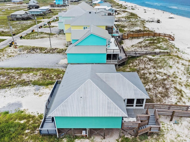 aerial view with a view of the beach and a water view