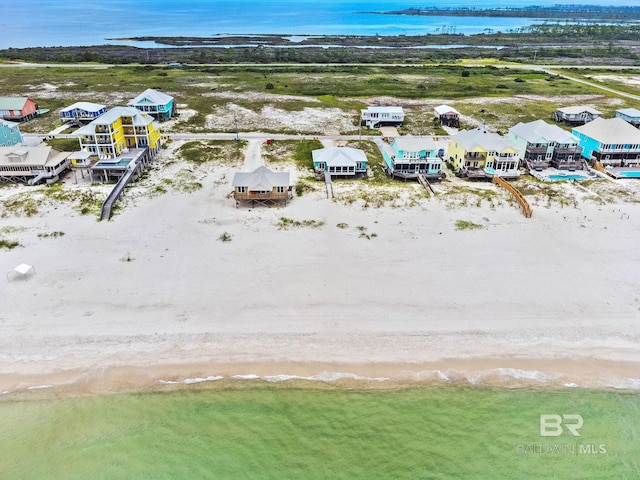 aerial view with a view of the beach and a water view