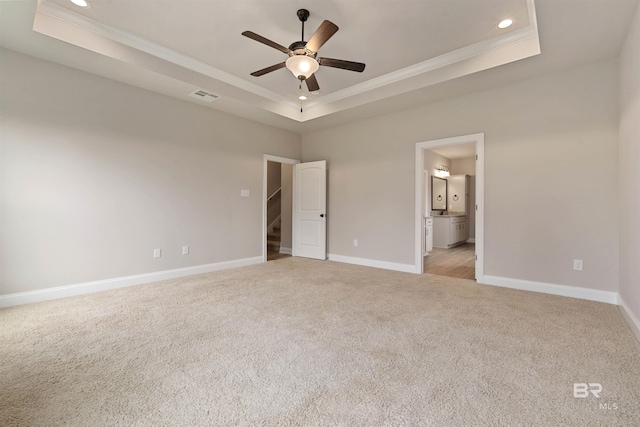 33861 Rutland Ln, Spanish Fort, AL 36527 - unfurnished bedroom with light colored carpet, crown molding, a tray ceiling, recessed lighting, and baseboards