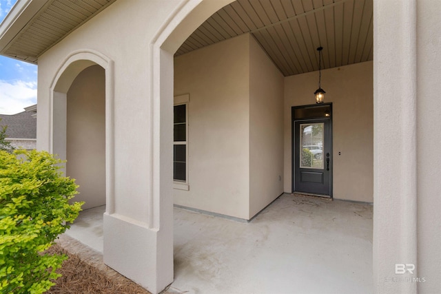 33861 Rutland Ln, Spanish Fort, AL 36527 - doorway to property with stucco siding and a patio area
