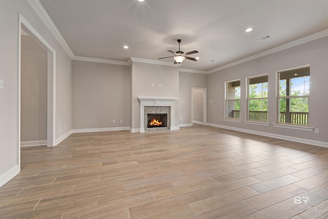 33861 Rutland Ln, Spanish Fort, AL 36527 - unfurnished living room with ceiling fan, recessed lighting, light wood-style flooring, baseboards, and a high end fireplace