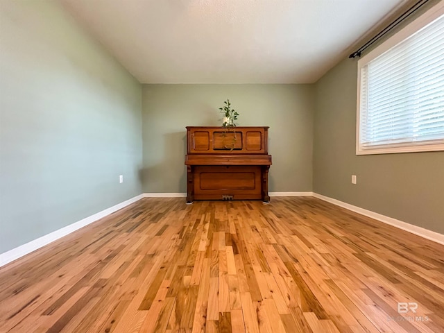 spare room featuring light hardwood / wood-style flooring