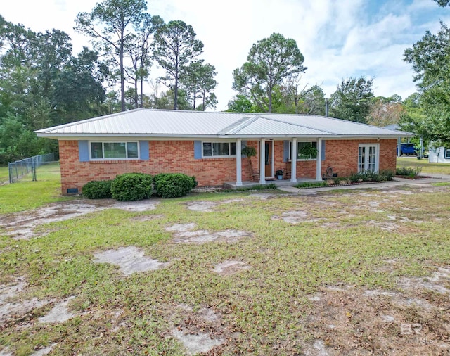 ranch-style house with a front lawn