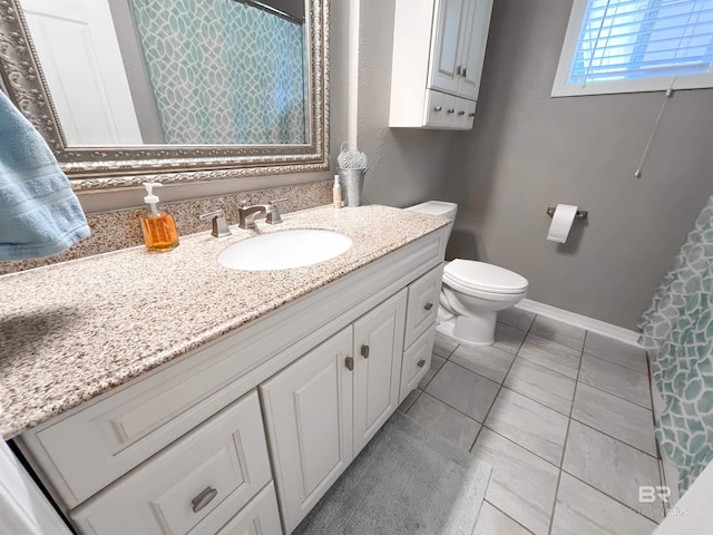 bathroom with vanity and toilet