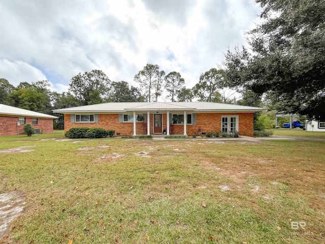 ranch-style home with a front lawn