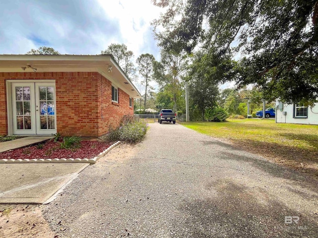 view of property exterior with a lawn