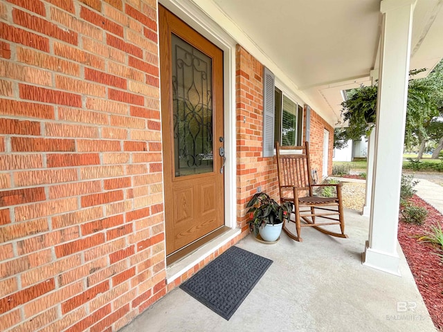 property entrance with covered porch