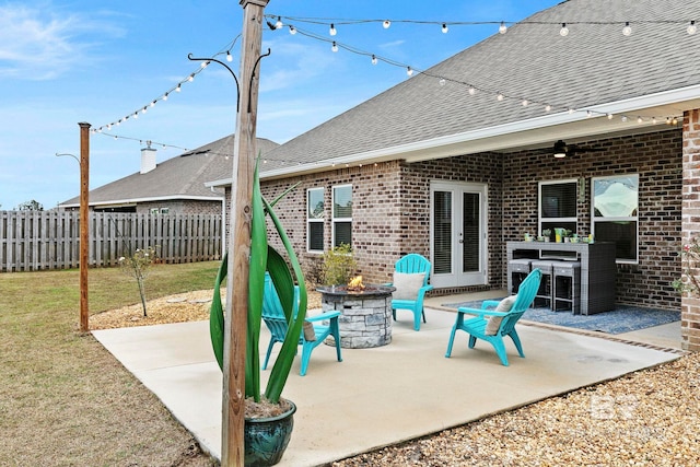 view of patio with a fire pit and ceiling fan