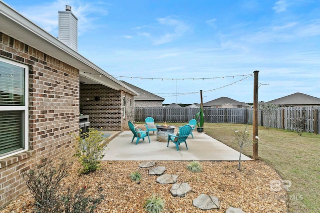 view of patio / terrace with a fire pit