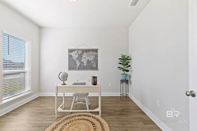 home office with hardwood / wood-style flooring and a wealth of natural light