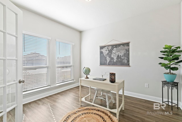 office area featuring french doors and dark hardwood / wood-style floors