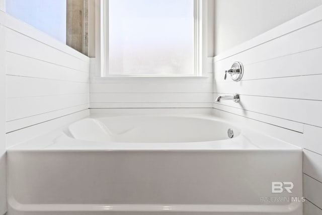 bathroom featuring a tub