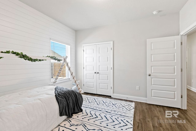 bedroom featuring a closet and hardwood / wood-style flooring