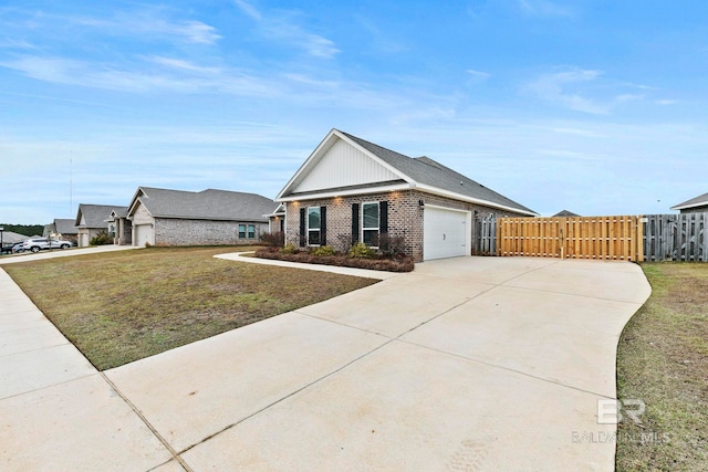 view of front of home with a garage and a front lawn