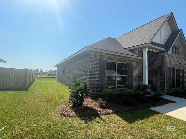 view of property exterior with a lawn