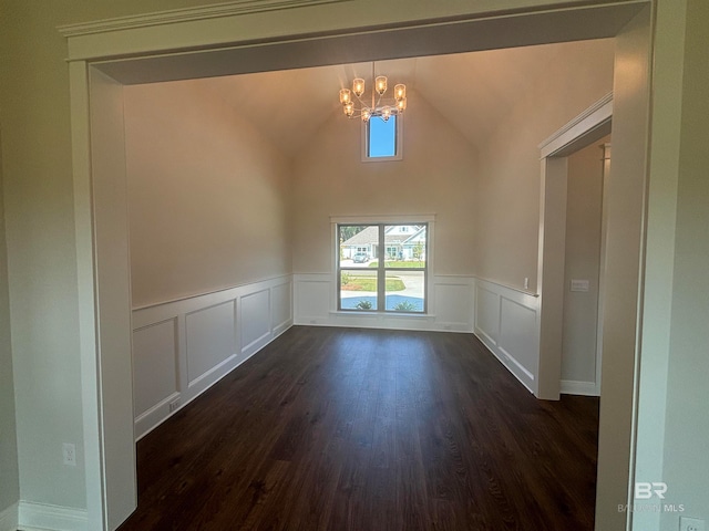 unfurnished dining area with dark hardwood / wood-style flooring, vaulted ceiling, and a notable chandelier