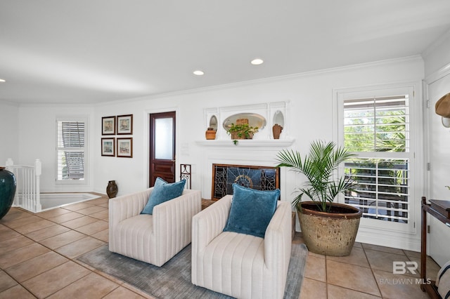 tiled living area featuring a fireplace, recessed lighting, and crown molding