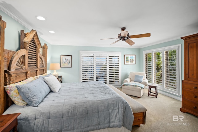 carpeted bedroom featuring ceiling fan, crown molding, and recessed lighting