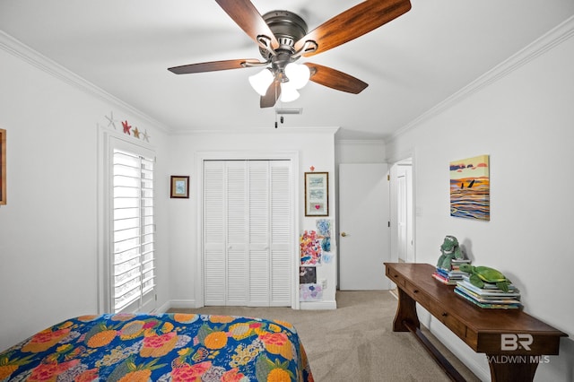 bedroom featuring carpet, visible vents, a closet, crown molding, and ceiling fan