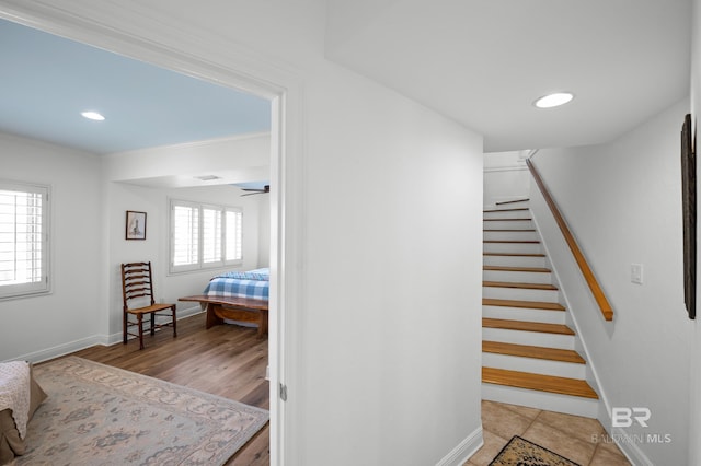 staircase with recessed lighting and baseboards