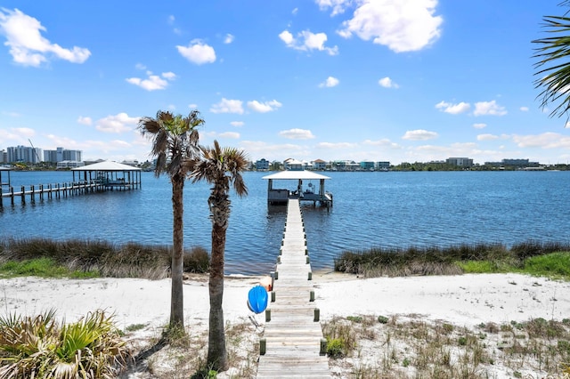 view of dock featuring boat lift and a water view